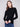 Black ribbed knit sweater featuring a chic mock neck design, perfect for versatile styling by Charlie B.