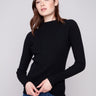 Black ribbed knit sweater featuring a chic mock neck design, perfect for versatile styling by Charlie B.