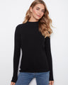 Black ribbed knit sweater with a slim fit design and long sleeves by Charlie B.