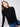 Elegant black sweater with a slim fit silhouette and ribbed texture, ideal for layering by Charlie B.