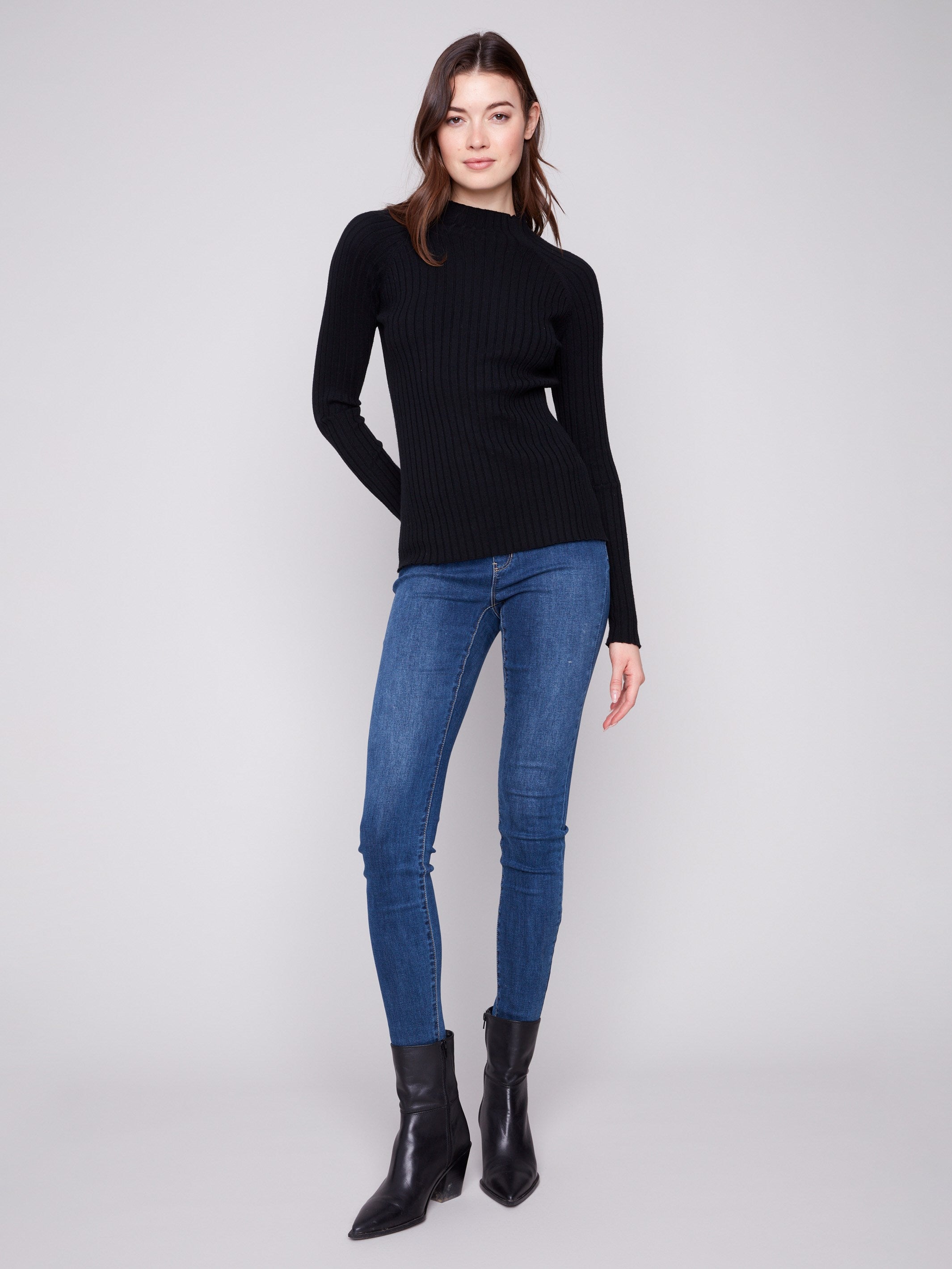 Stylish long-sleeved black sweater with a flattering slim fit and cozy ribbed knit by Charlie B.