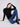 Ribbed knit black sweater showcasing sophisticated long sleeves and modern style by Charlie B.