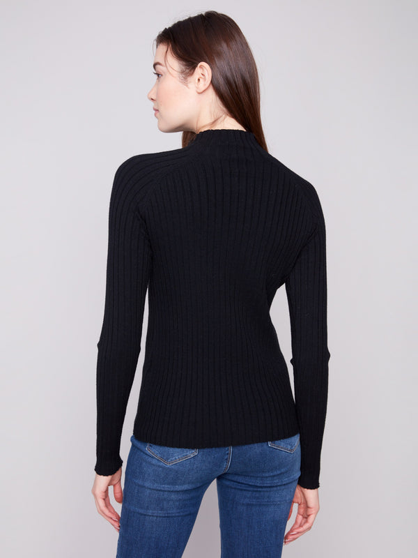 Sophisticated ribbed knit detailing enhances the classic look of this black sweater by Charlie B.