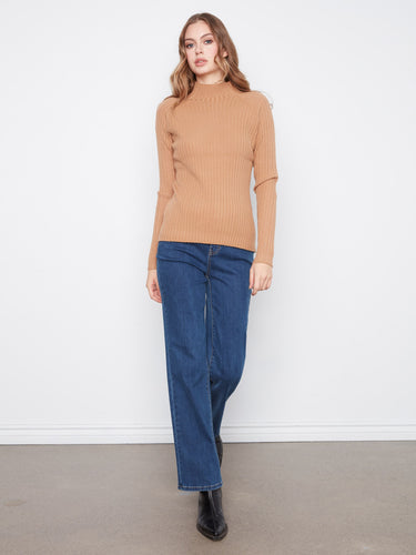 Long sleeves provide warmth and style in this versatile piece, designed by Charlie B.