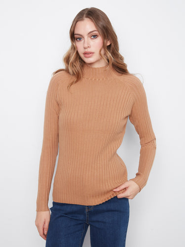 Long sleeve design adds functionality to this sleek and modern sweater, made by Charlie B.