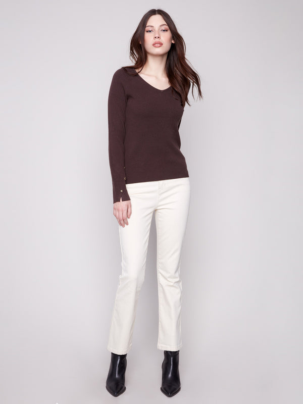 Elegant mocha sweater showcasing ribbed texture and slit cuffs for a modern touch by Charlie B.