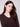 Stylish V-neck mocha sweater accentuated with intricate heart rivets on the sleeves by Charlie B.