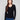Black sweater featuring a slim fit and heart rivets on the sleeves, perfect for a chic silhouette by Charlie B.