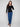 Chic black ribbed sweater showcasing a flattering slim fit and charming heart rivets by Charlie B.
