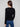 Sophisticated black sweater with subtle ribbed texture, complemented by elegant slit cuffs by Charlie B.