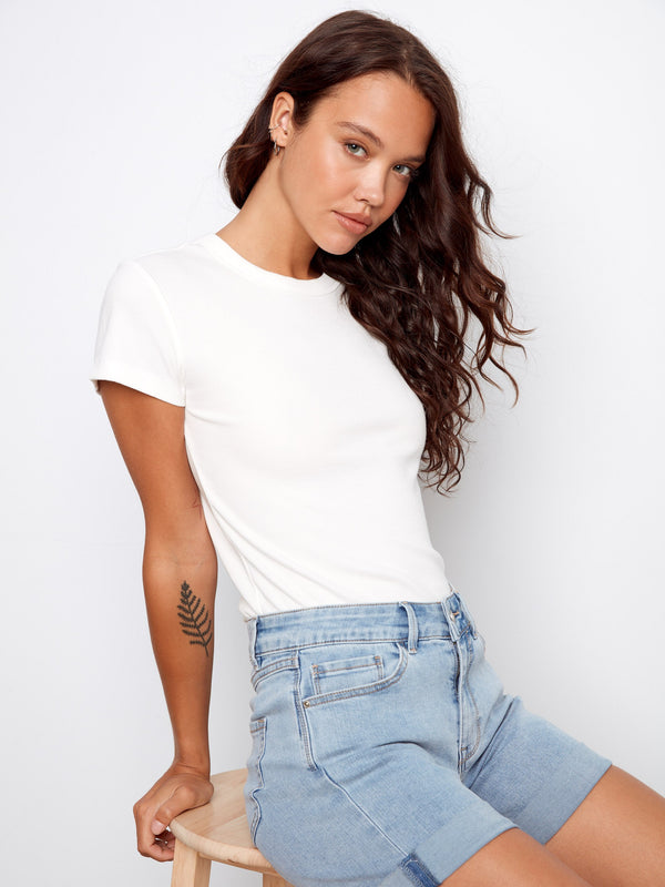 Crafted in stretch denim, these shorts provide ease of movement while maintaining their stylish silhouette by Charlie B.