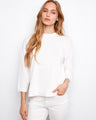White cotton sweater featuring a crew neckline and stylish 3/4 sleeves, designed for comfort by Charlie B.