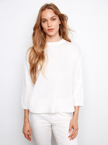 Chic white sweater with versatile 3/4 sleeves, offering a relaxed fit in pure cotton by Charlie B.