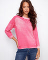 Pink sweater featuring a crew neckline, crafted from 100% cotton for comfort and style by Charlie B.