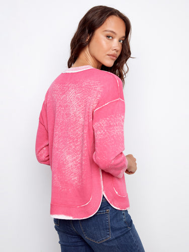 Rounded hem detail enhances the casual chic look of this pink top by Charlie B.