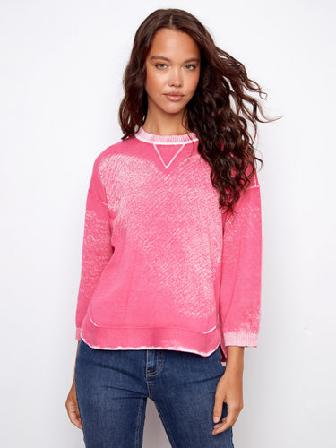 Made from 100% cotton, this pink sweater offers breathable comfort and style by Charlie B.