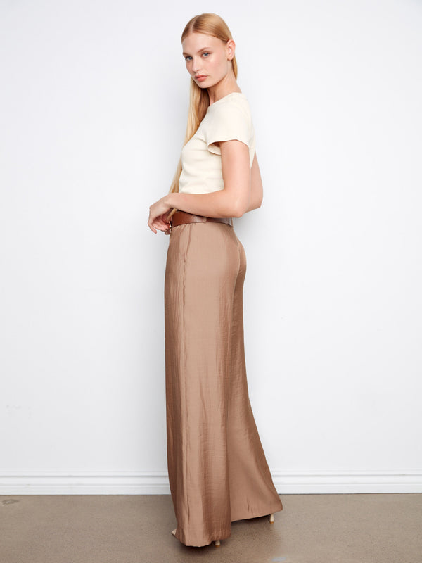 Highlighting a belted design, these pants add a touch of sophistication to your ensemble. By Charlie B.