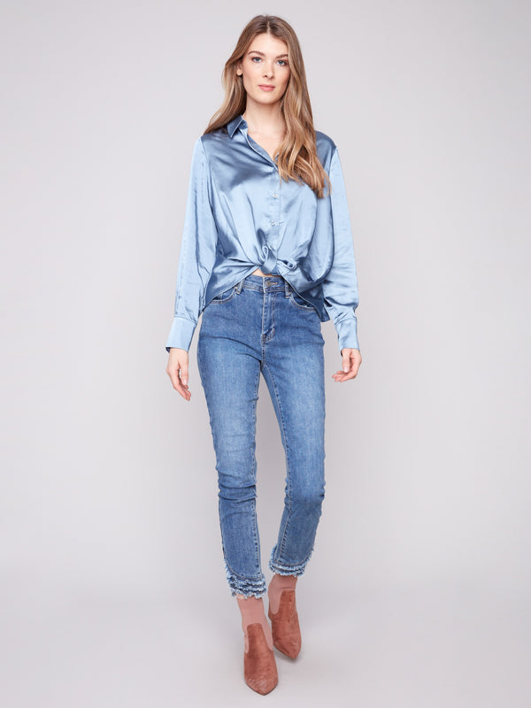 Elegant blue button-down shirt with a twisted front detail, adding flair to any outfit by Charlie B.