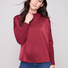 Cabernet satin knit top with ribbed cuffs and neckline, offering a cozy yet chic look by Charlie B.