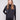 Black satin knit top with drop shoulders and ribbed cuffs, crafted for a sleek look by Charlie B.