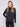 Black satin knit top with drop shoulders and ribbed cuffs, crafted for a sleek look by Charlie B.