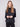 Stylish satin knit top with front seam detail and drop shoulders, offering modern elegance by Charlie B.