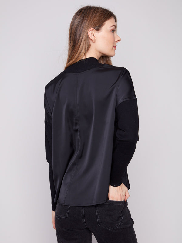 Satin-knit combo black top showcasing ribbed cuffs and neckline, ideal for a sophisticated style by Charlie B.