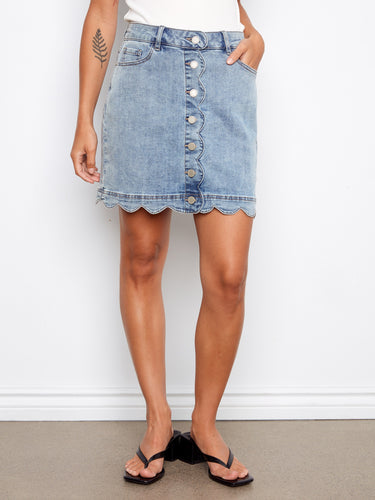 This denim skirt features a unique scalloped hem design, adding flair to any outfit. Perfect for casual outings. By Charlie B.
