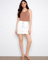 White skort with scalloped hem and stretch twill fabric, featuring button front by Charlie B.