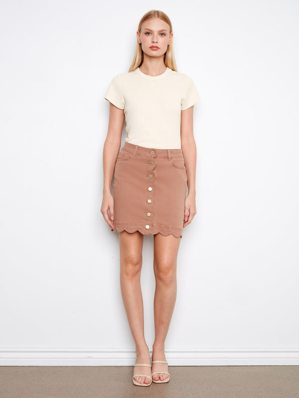 Adorned with front buttons, this skirt adds a touch of elegance to any outfit. A must-have addition by Charlie B.