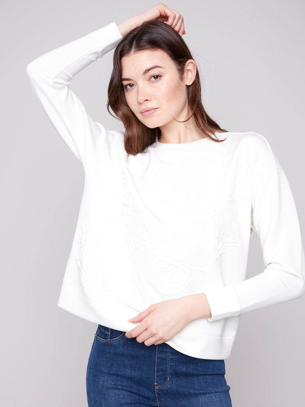 Ecru Scuba Knit Top featuring long sleeves and sophisticated soutache front embellishments for added elegance by Charlie B.
