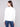 Ecru Scuba Knit Top enhanced with a classic crew neckline and delicate soutache accents to elevate your style by Charlie B.