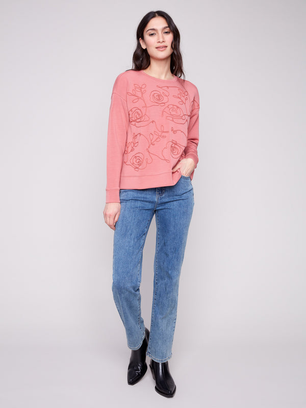 A chic Primrose Scuba Knit Top featuring exquisite soutache front detail that adds a touch of elegance to your wardrobe by Charlie B.