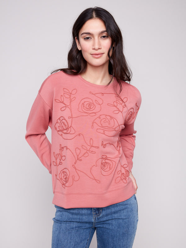 Experience the comfort of the Primrose Scuba Knit Top with its versatile long sleeves, ideal for layering in cooler weather by Charlie B.