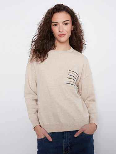 Almond sweater featuring drop shoulders and a sequin-striped pocket, perfect for casual elegance by Charlie B.