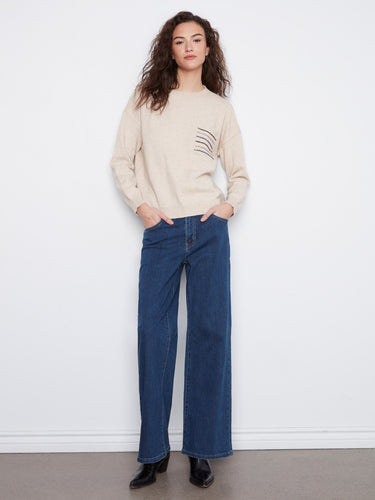 Chic crew neckline sweater in heather almond with striped sequin accents on the pocket by Charlie B.