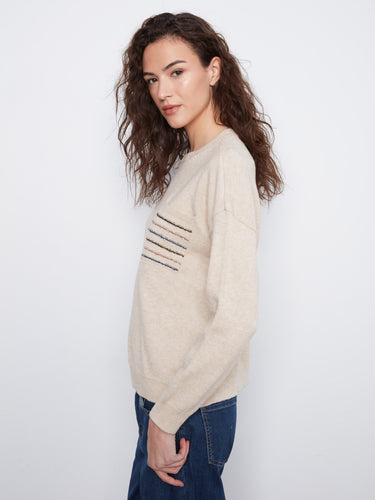 Heather almond crew neck sweater showcasing stylish long sleeves and a sequined pocket by Charlie B.