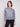 Heather grey sweater featuring a drop shoulder design with shimmering sequins for added style by Charlie B.