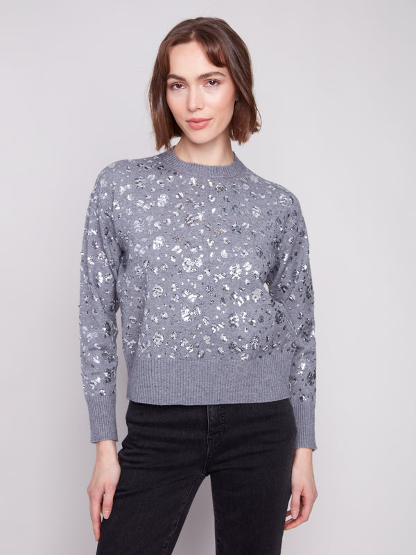 Heather grey sweater featuring a drop shoulder design with shimmering sequins for added style by Charlie B.