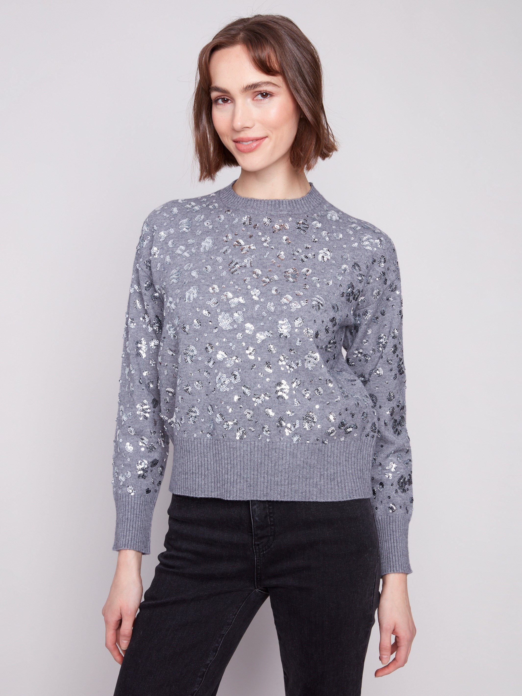 Elegant heather grey sweater adorned with sequins and a classic crew neck for versatile styling by Charlie B.