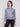 Elegant heather grey sweater adorned with sequins and a classic crew neck for versatile styling by Charlie B.