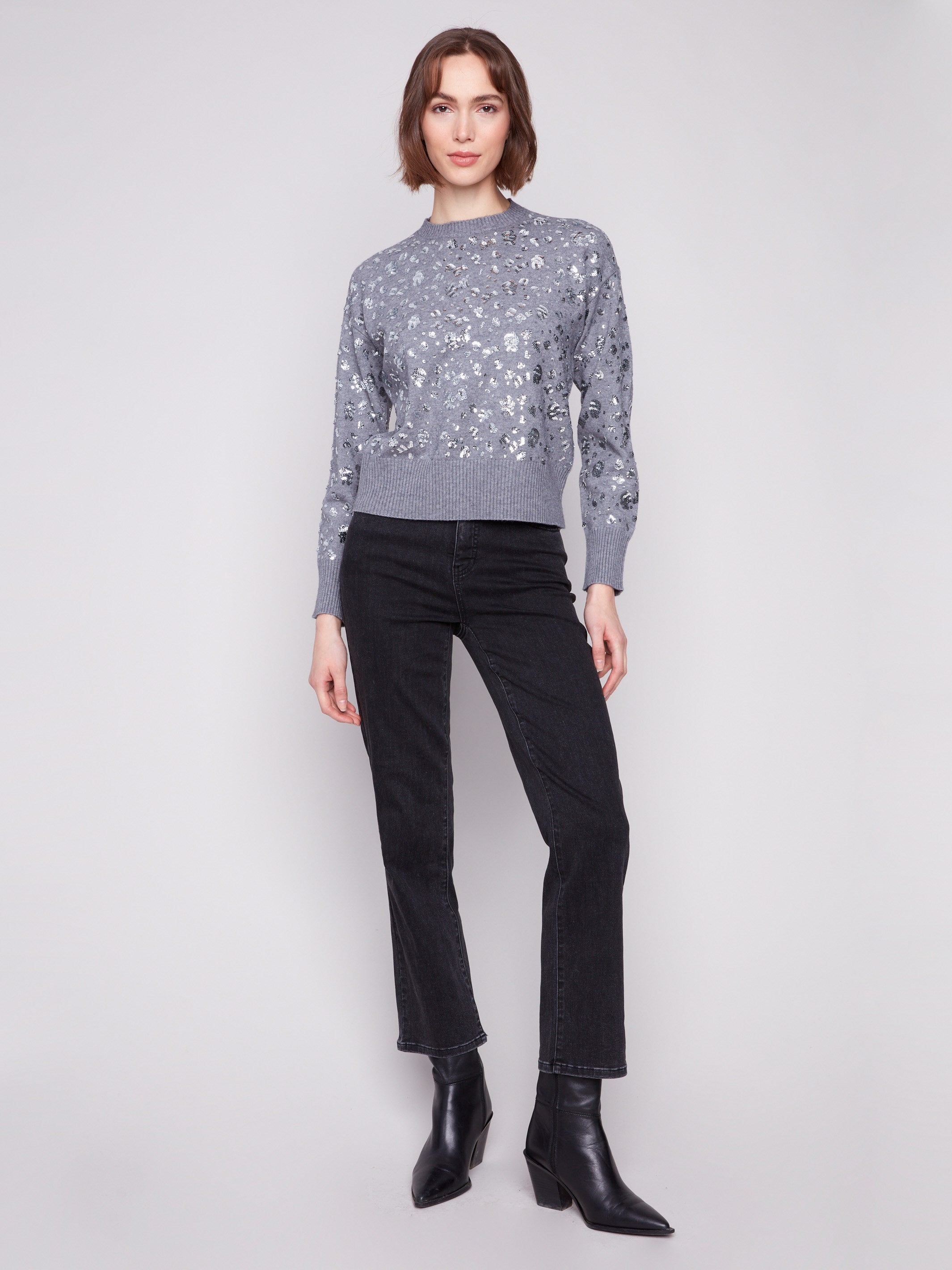 Dark grey sweater designed with a slightly cropped fit, embellished with eye-catching sequins by Charlie B.