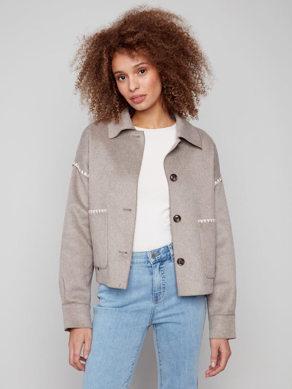 Oatmeal wool jacket featuring a classic shirt collar and elegant button cuffs, perfect for layering by Charlie B.