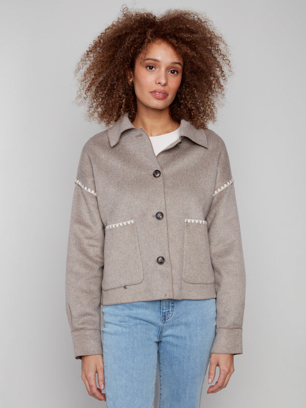 Chic oatmeal wool jacket with functional patch pockets on the front, offering both style and utility by Charlie B.