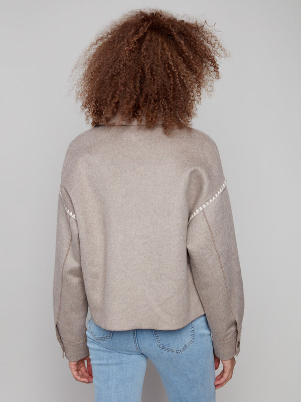 Sophisticated wool jacket designed with button cuffs, adding a refined finish to any ensemble by Charlie B.