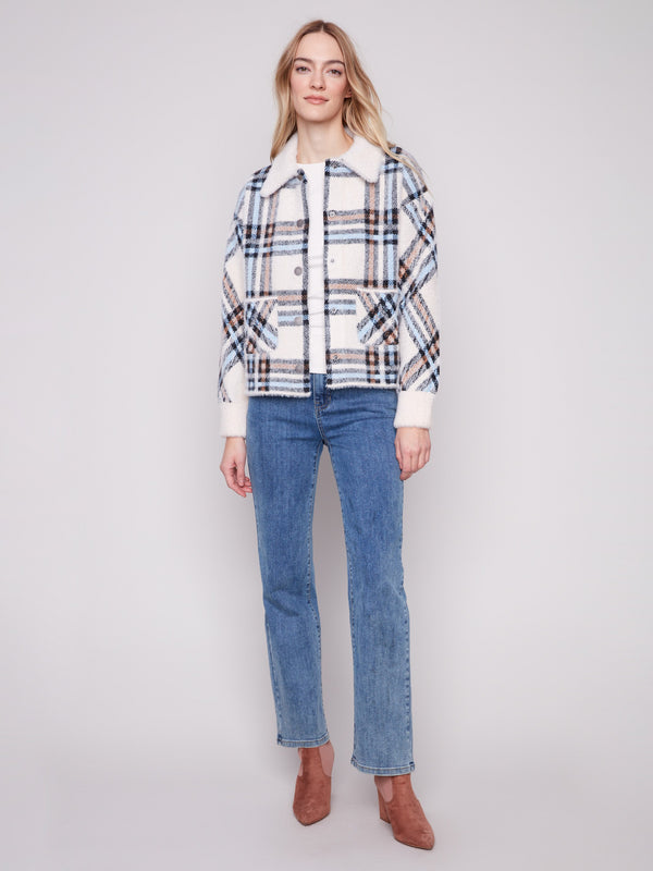 Ecru plaid knit jacket with a snap button closure and cozy patch pockets, designed for a modern look by Charlie B.