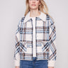 Experience the plushy texture of this ecru plaid knit jacket, perfect for stylish layering by Charlie B.