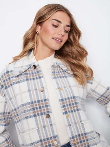 Chic plaid jacket with convenient patch pockets, ideal for keeping essentials close and hands warm by Charlie B.