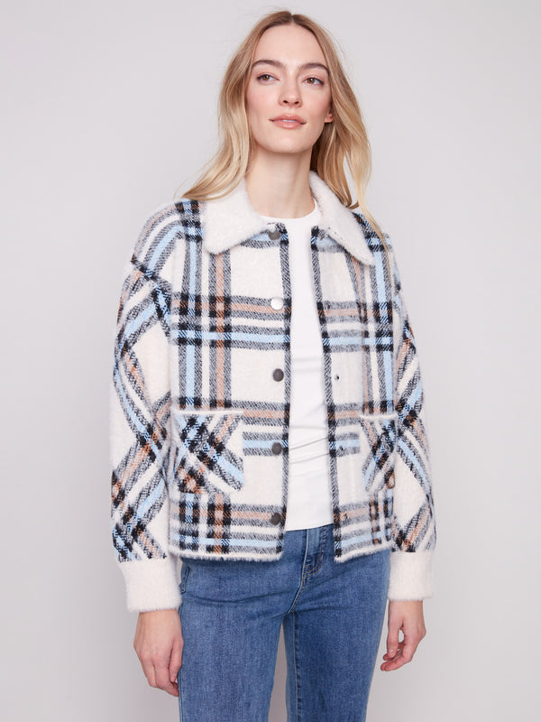 Stay warm in style with the snap button closure on this trendy ecru plaid knit jacket by Charlie B.
