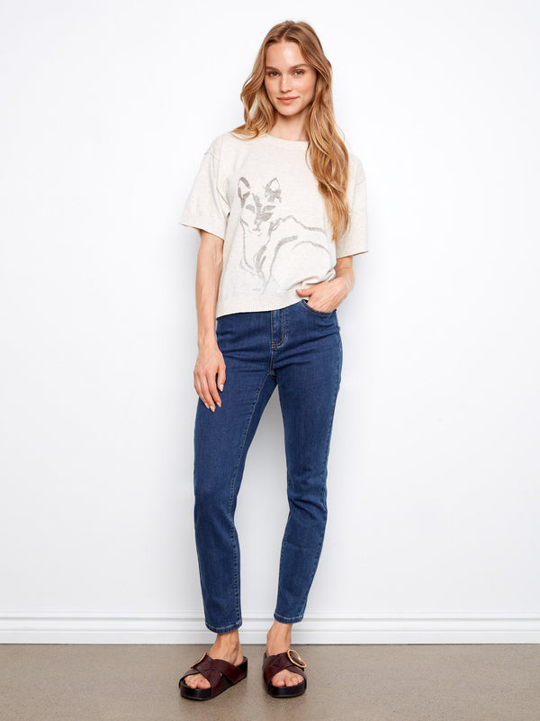 Adorned with an eye-catching animal print, this short-sleeved top adds a playful touch to any outfit. Crafted in 100% cotton by Charlie B.